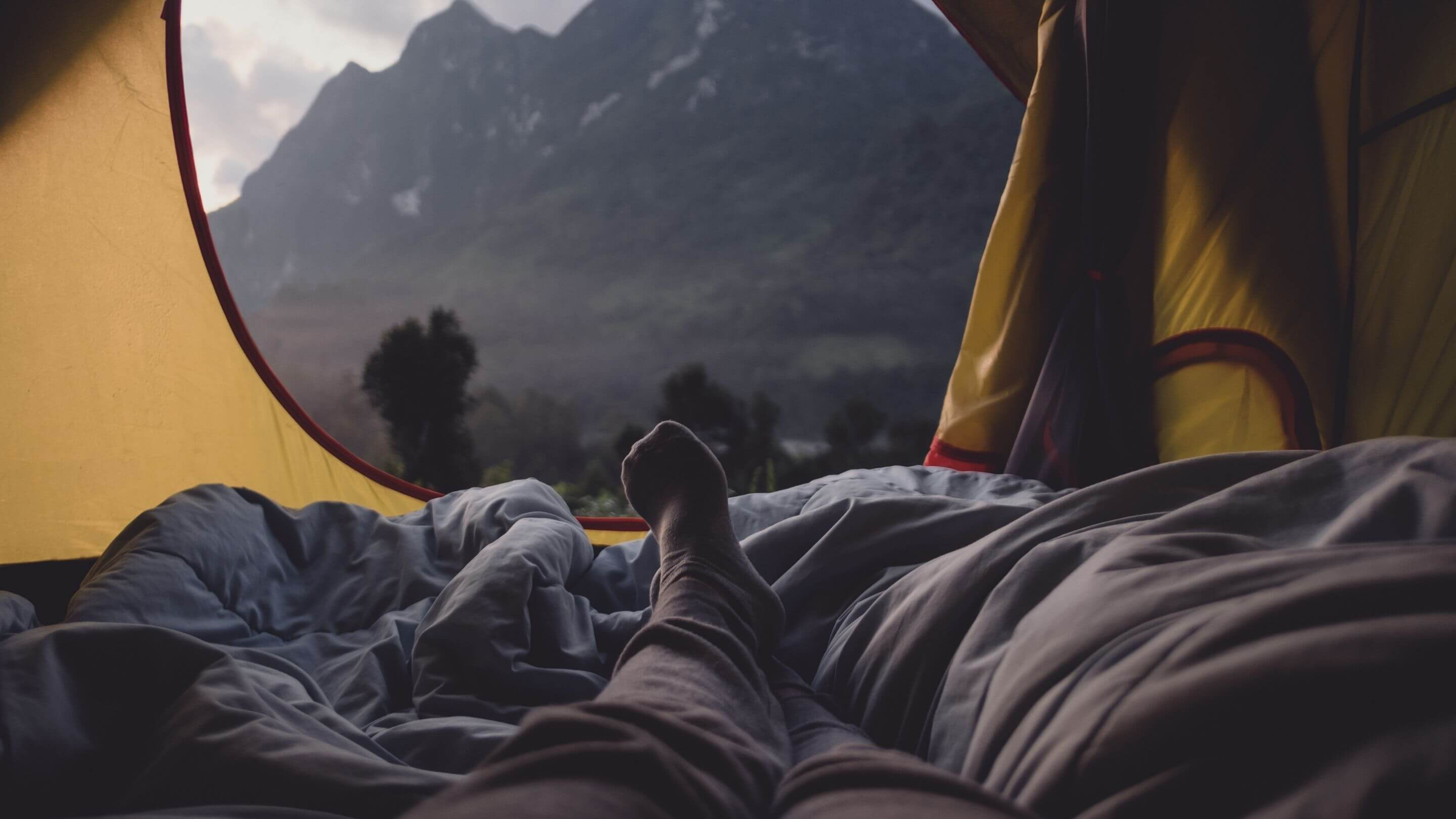 view of mountain from inside a tent