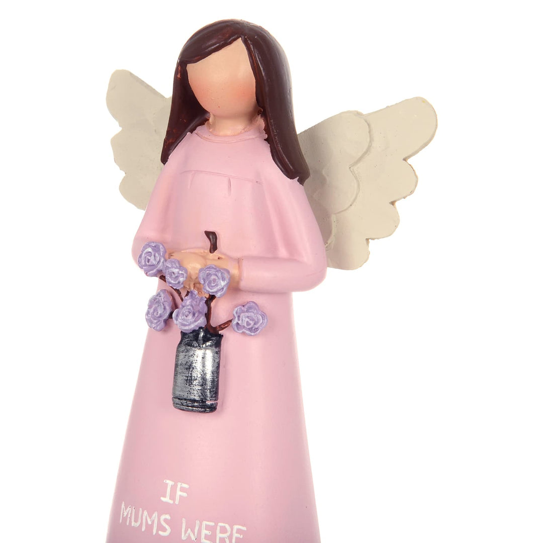 Close up of a pink angel figure holding a bouquet of flowers