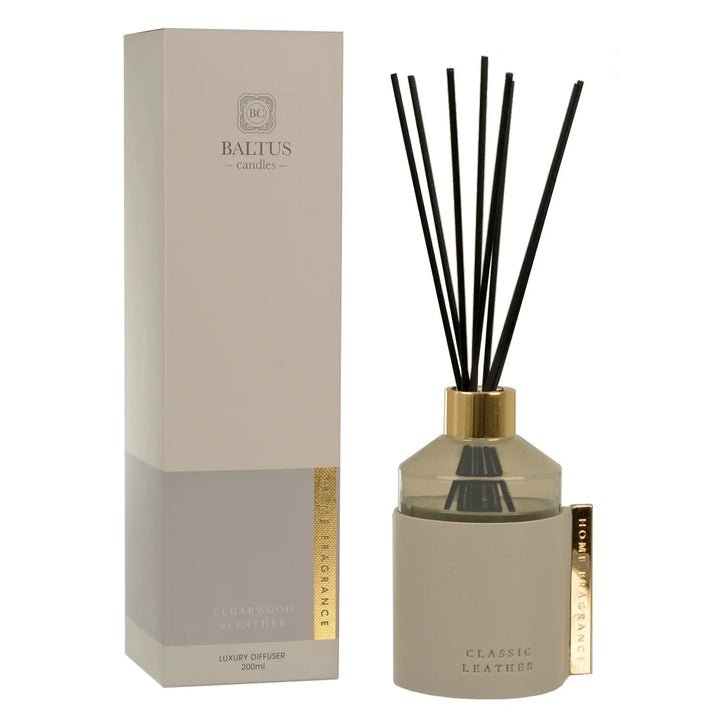 Cedarwood & Leather scented Classic Leather reed diffuser with gold tone clip and top, black reeds and box packaging