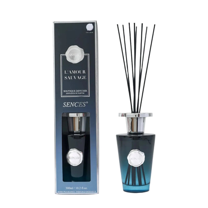 Large boutique diffuser with blue ombre glass bottle and black reeds in gift box packaging