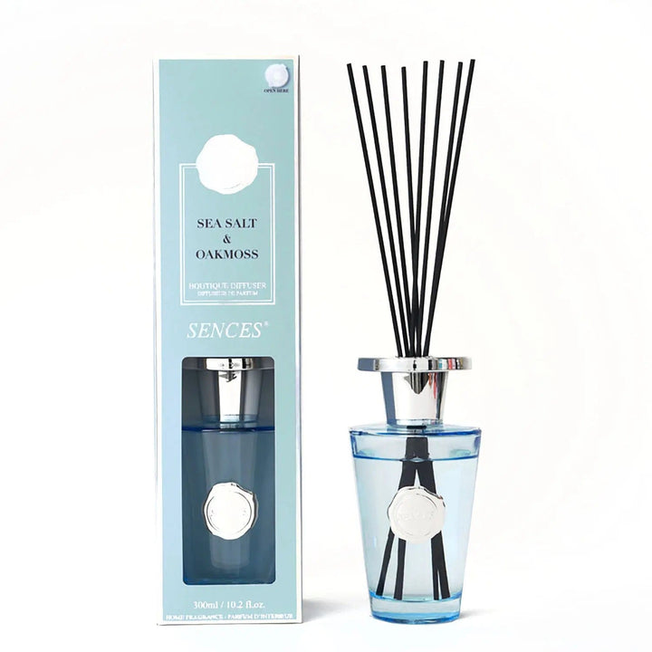 Sea salt and oakmoss scented diffuser in blue with silver top and black reeds