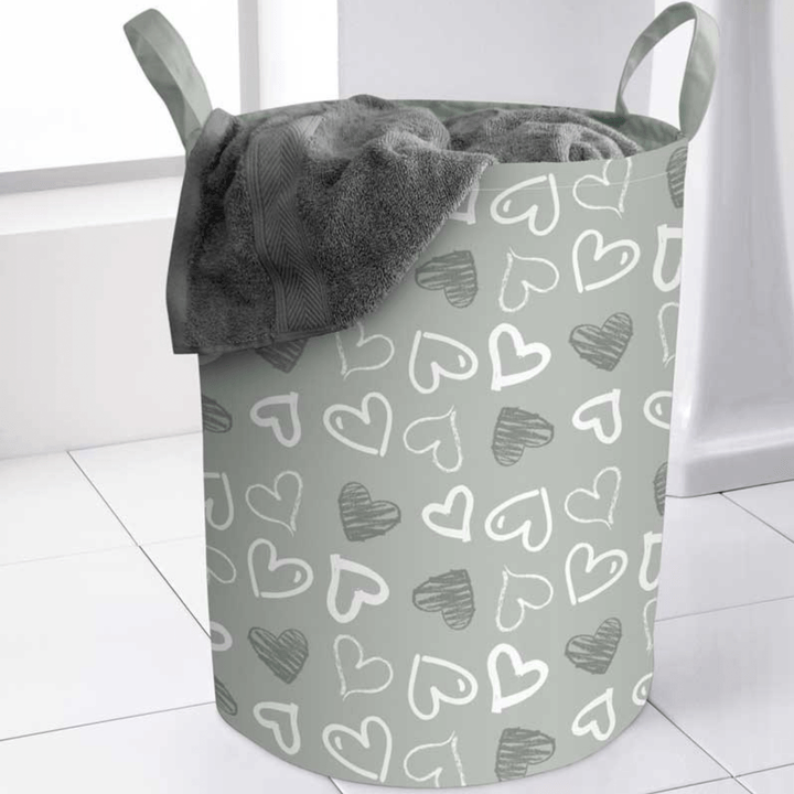 grey hearts repeated pattern on laundry bag with grey towel inside