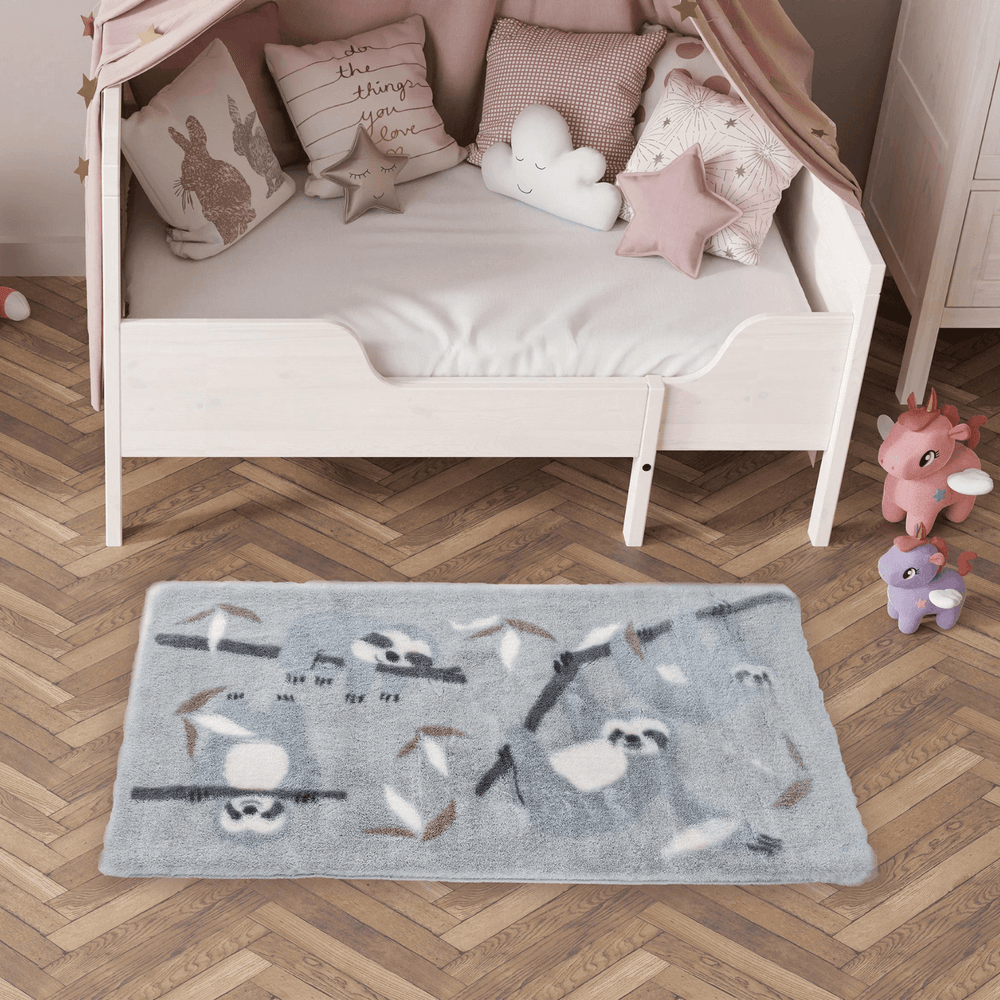 grey colour sloth pattern rug beside bed in kids playroom