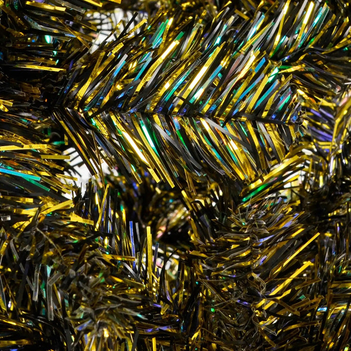 Iridescent tinsel Christmas tree branches close up