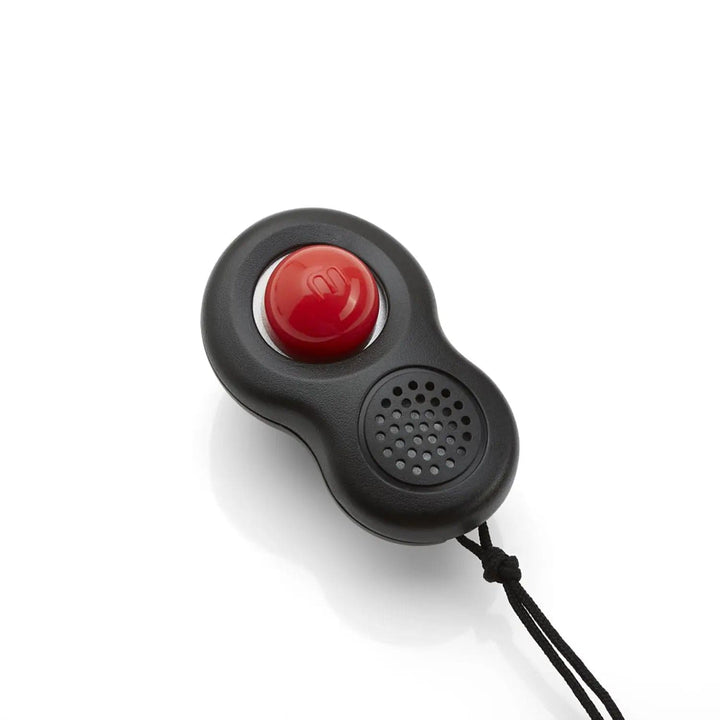 Close up of  a Clikka dog training clicker with big red clicker button