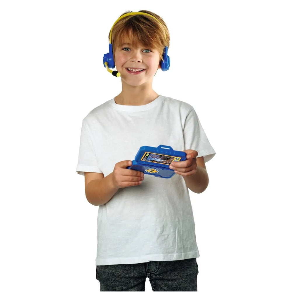 Boy wearing Fireman Sam Headset with microphone, holding an opening smart phone for role play fun