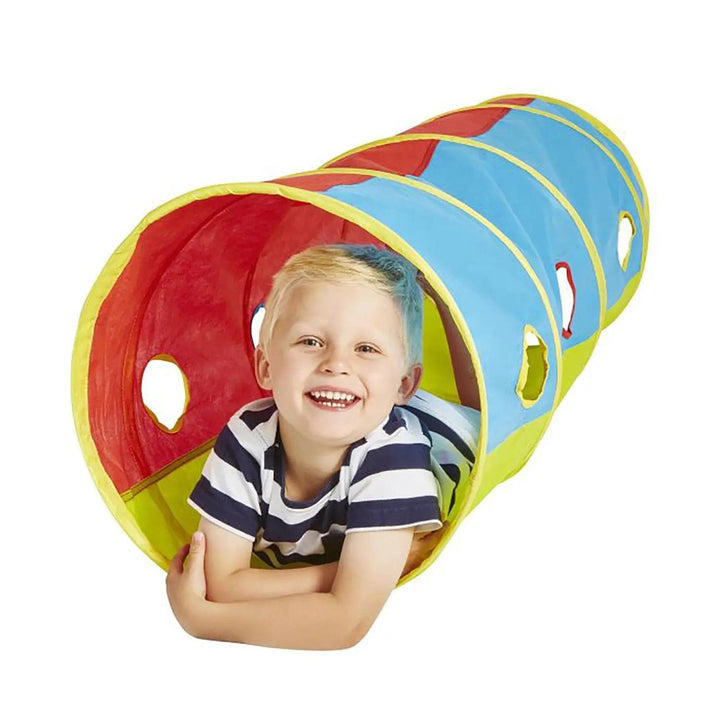 Boy lying inside a pop up play tunnel in bright colours for indoors and out in the garden