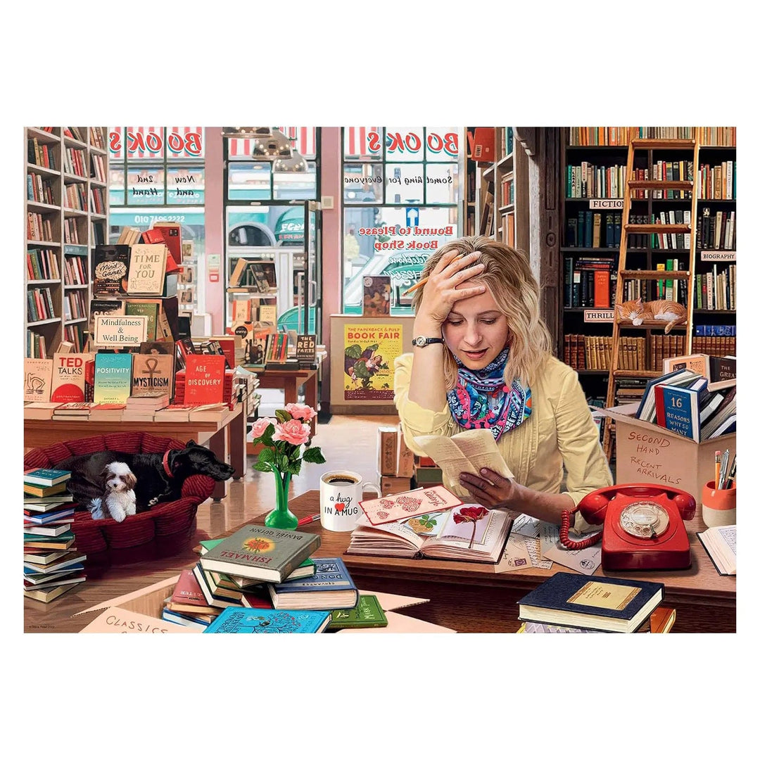 Lady in a book shop with retro red telephone