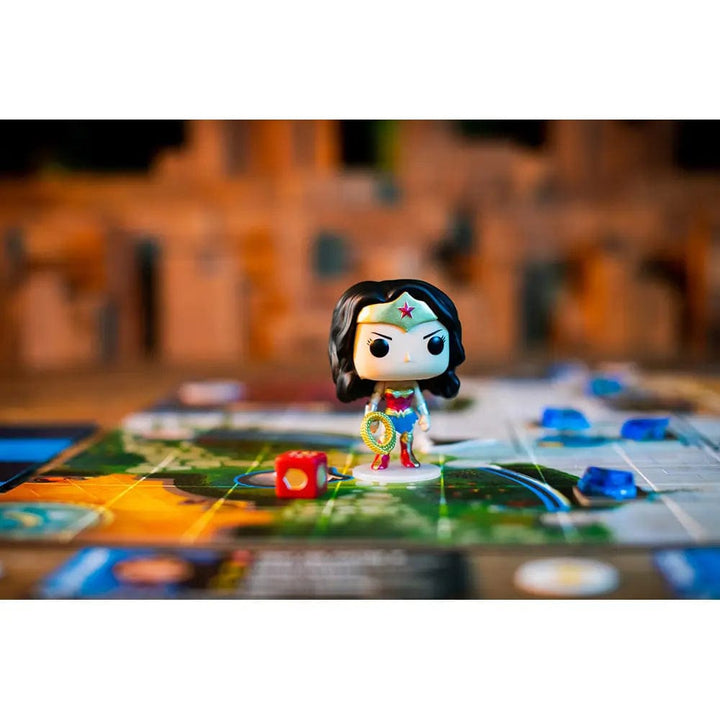 Funko wonder woman vinyl figure with lasso of truth on playable map from funkoverse game