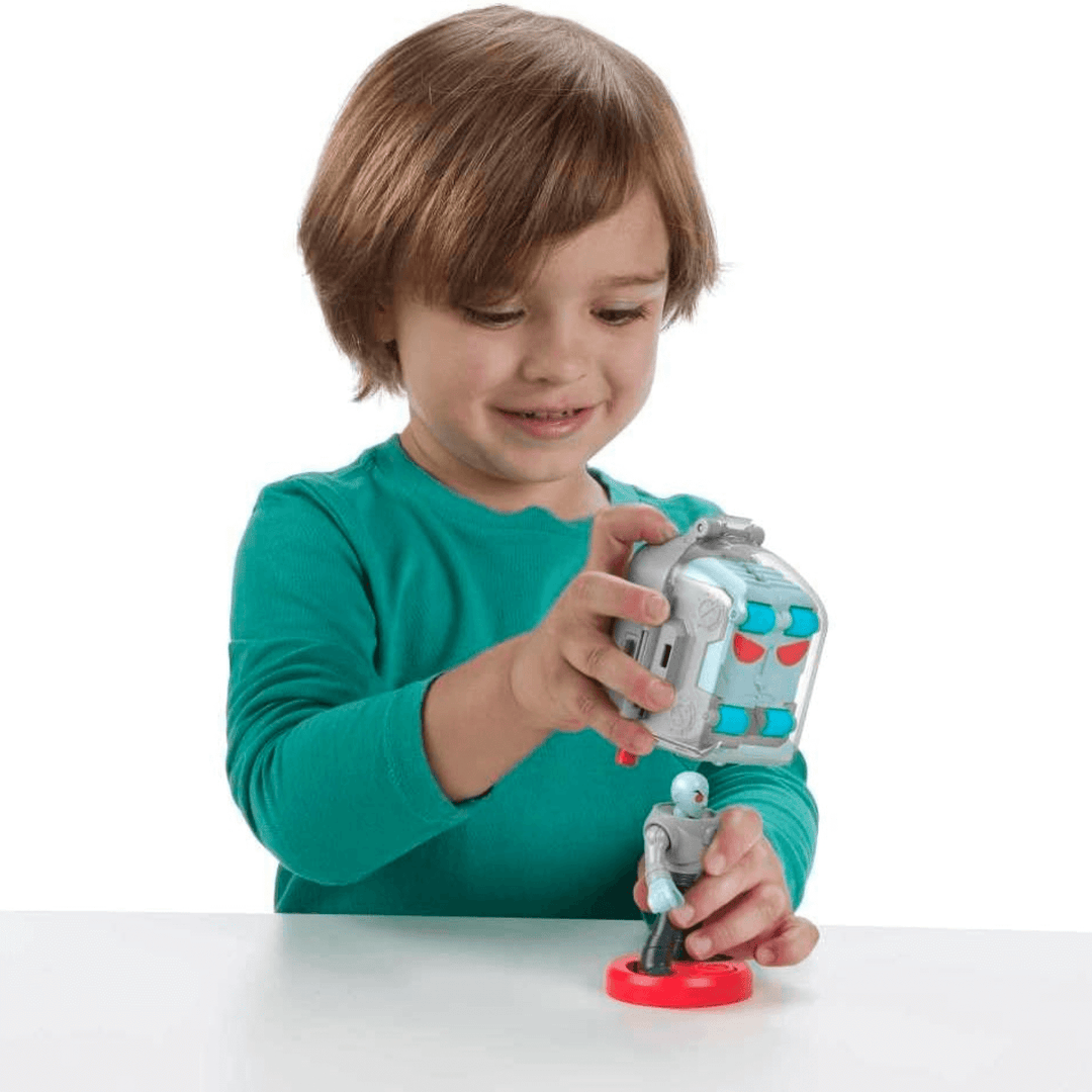 young boy plays with mr freeze action figure anf oversized helmet