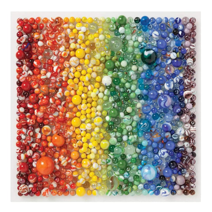 A rainbow of coloured marbles of all sizes