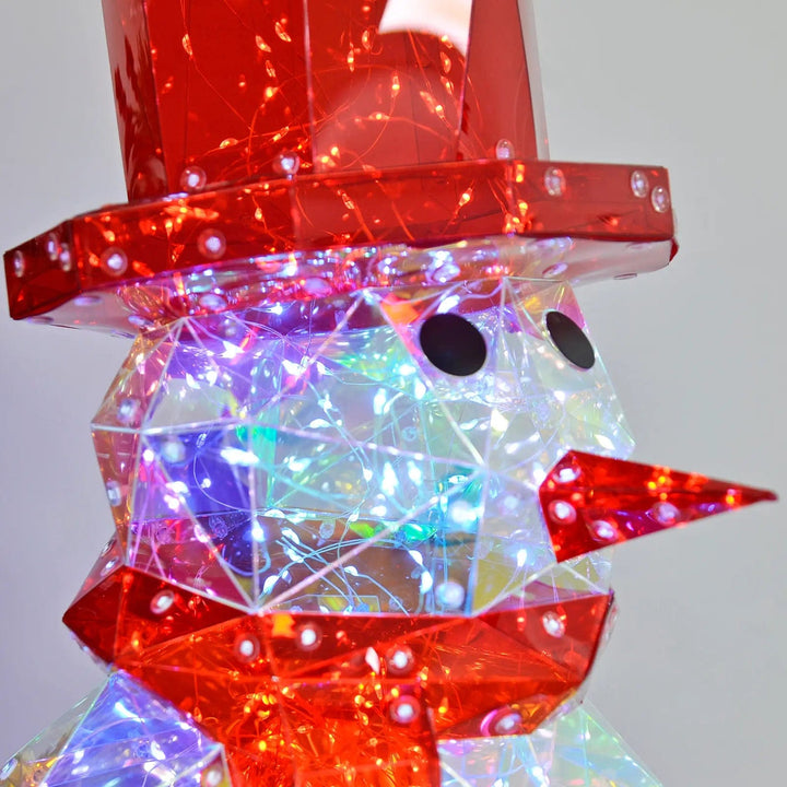 Close up of white LED lights in a Stralightz Snowman lamp with red nose, hat and scarf