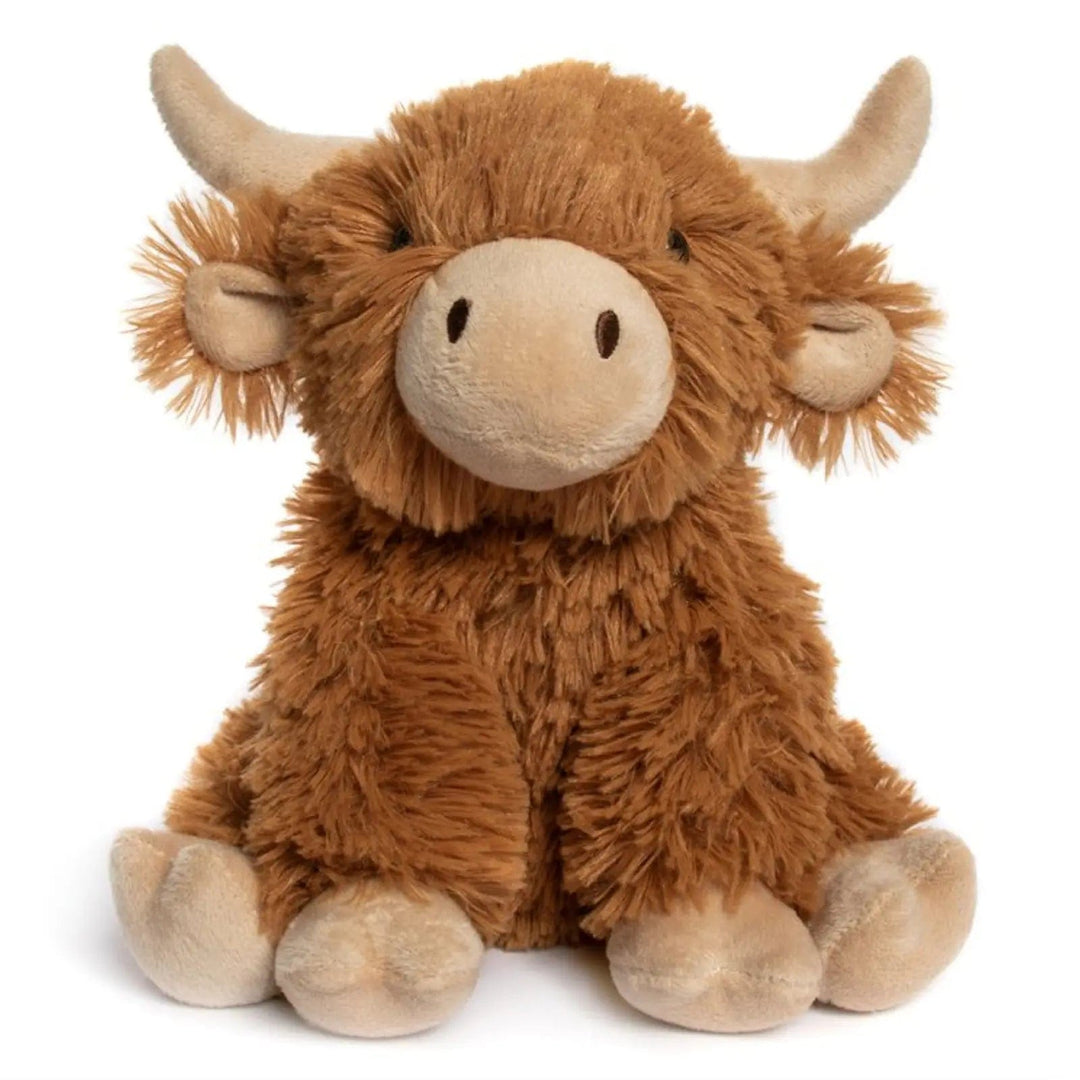 Sitting Highland Cow with long orange hair and soft pink horns, ears, nose and hooves