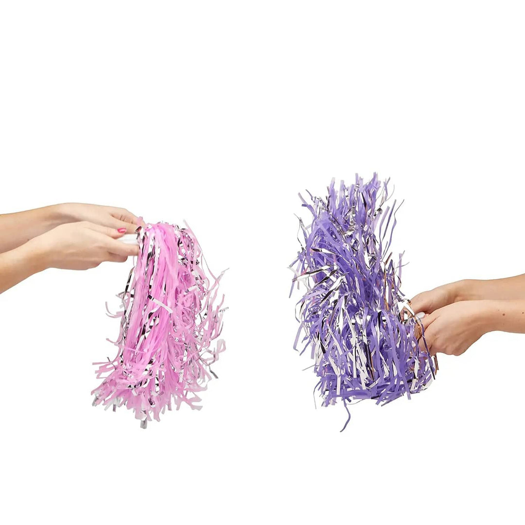 hands holding purple and pink sets of cheerleader pom poms for role play and Halloween costumes