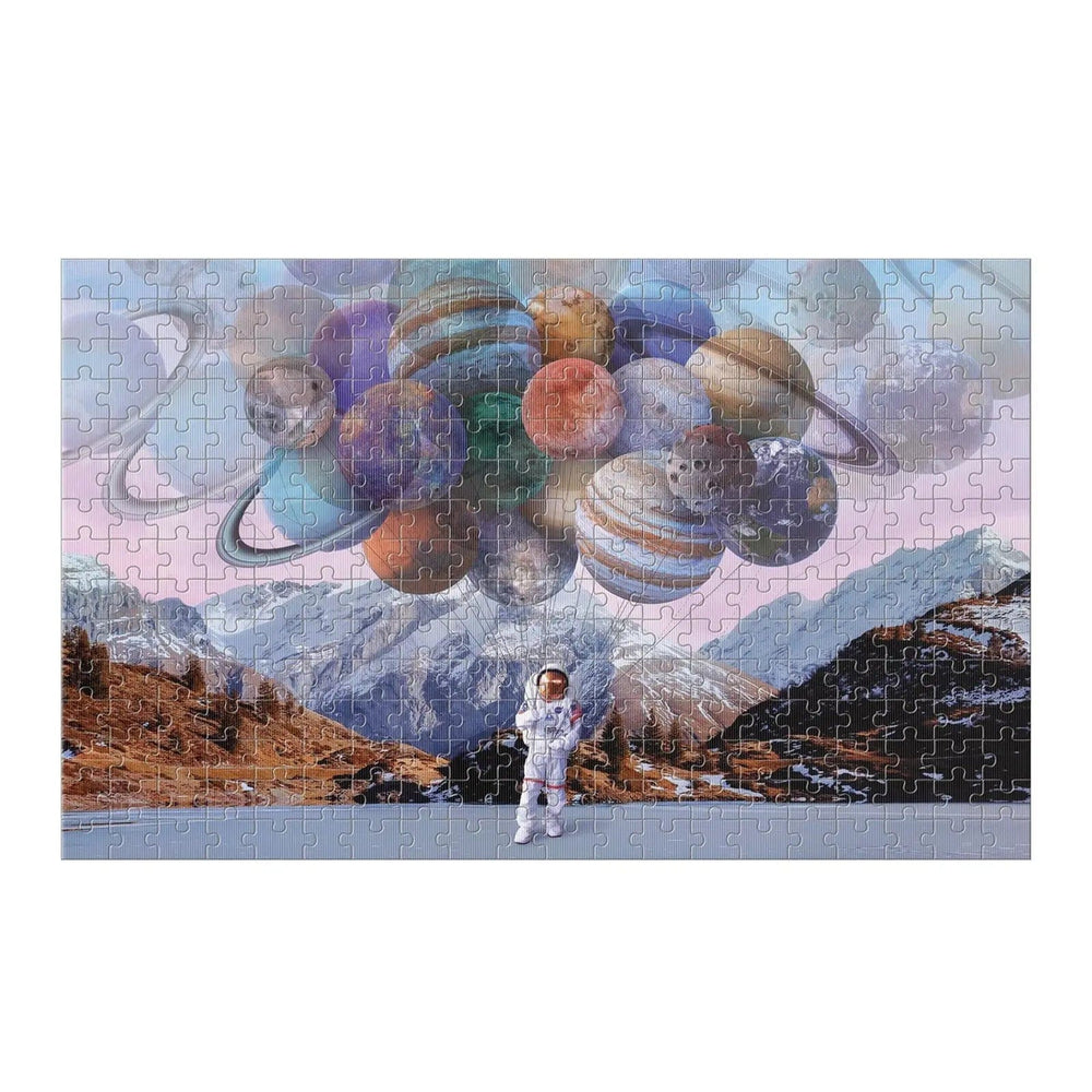 Completed Space Bound 300 piece jigsaw puzzle with spaceman and planet balloons