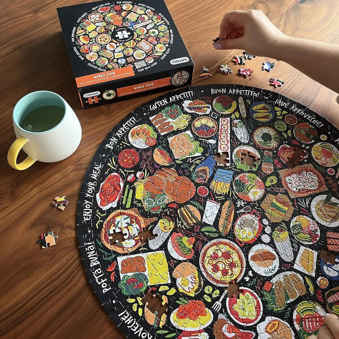 Person completing a circular jigsaw puzzle with food illustration