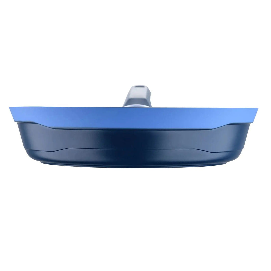 Side profile of a two tone blue frying pan