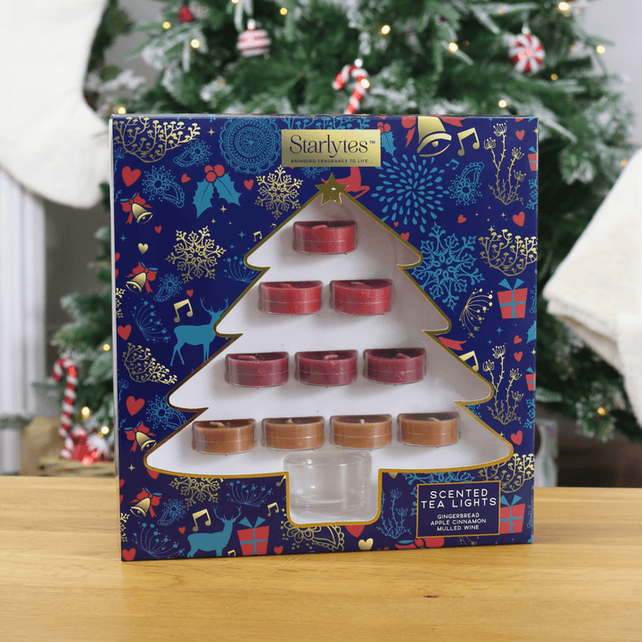 tea light gift set in front of christmas tree on coffee table