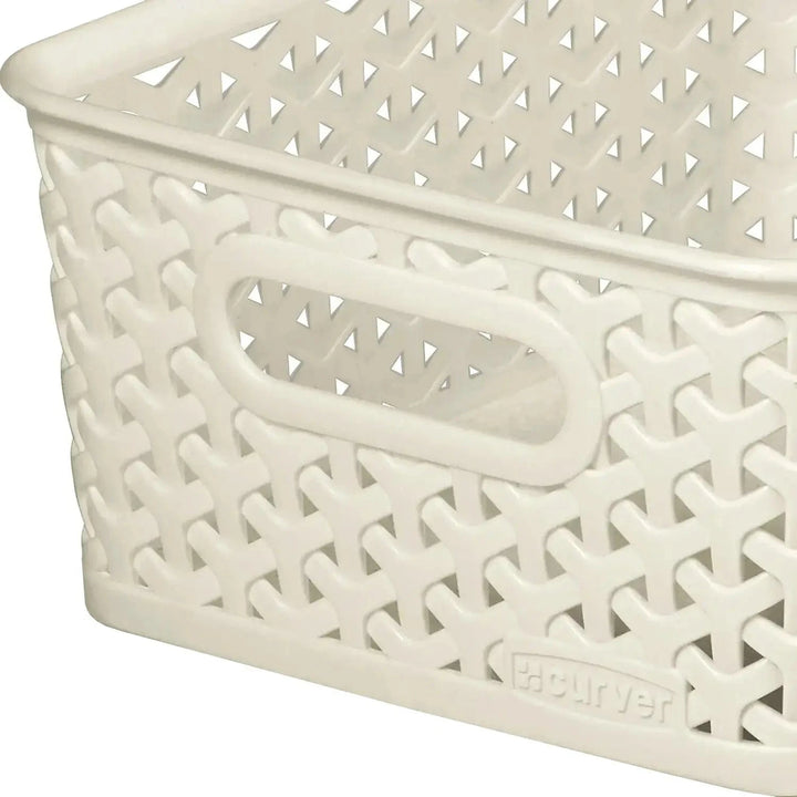 Close up of handle on a Curver cream colour plastic storage basket