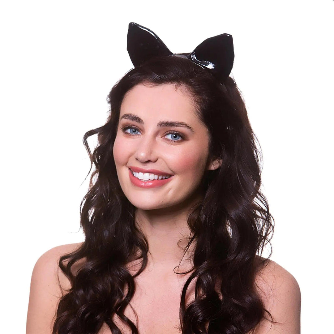 Lady wearing a set of black PVC cat ears on a headband for fancy dress costumes