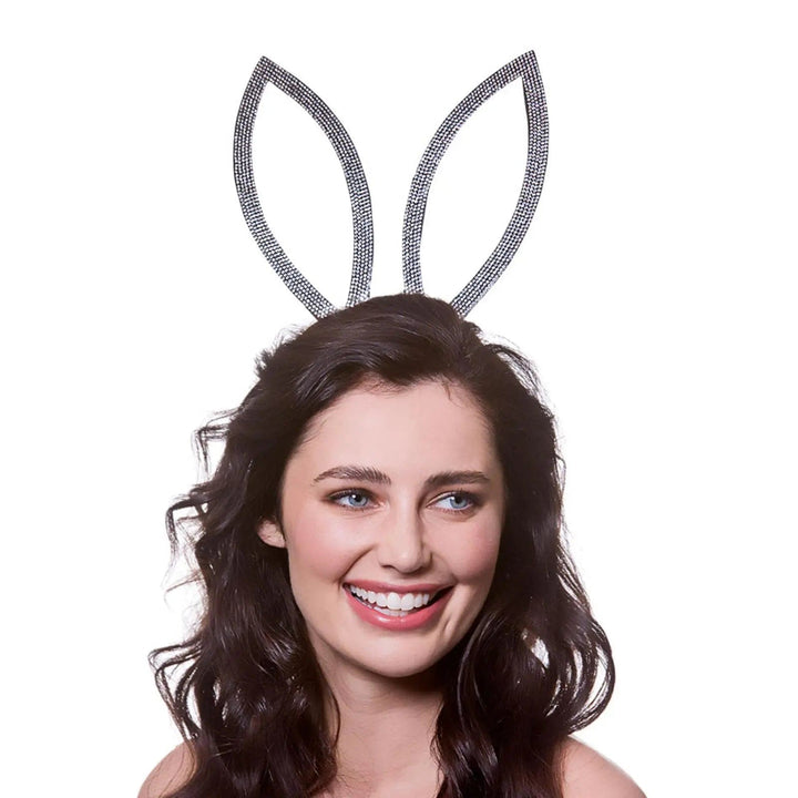 Young lady wearing a pair of sparkling diamante bunny ears for fancy dress parties