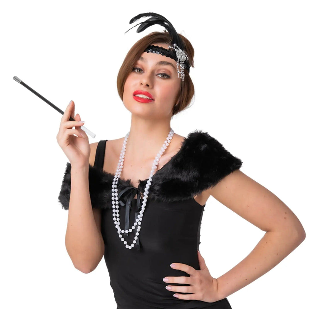 Lady wearing a 4 piece Flapper Girl accessories set with black feather headband, shawl, pearls and cigarette holder