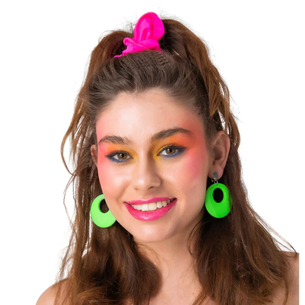 Lady wearing 80s disc earrings in bright neon green for hen nights