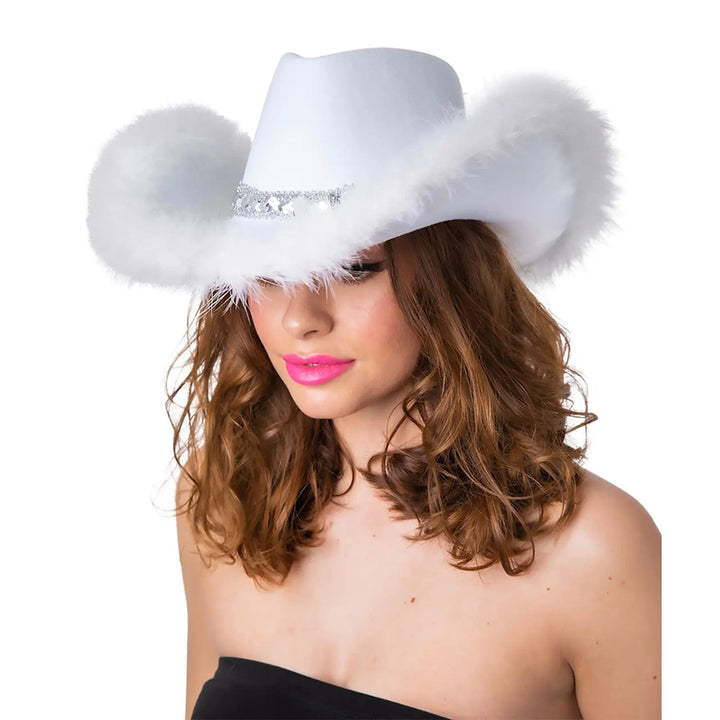 Lady wearing a white cowgirl hat with feathers and silver sequins for hen nights and fancy dress parties