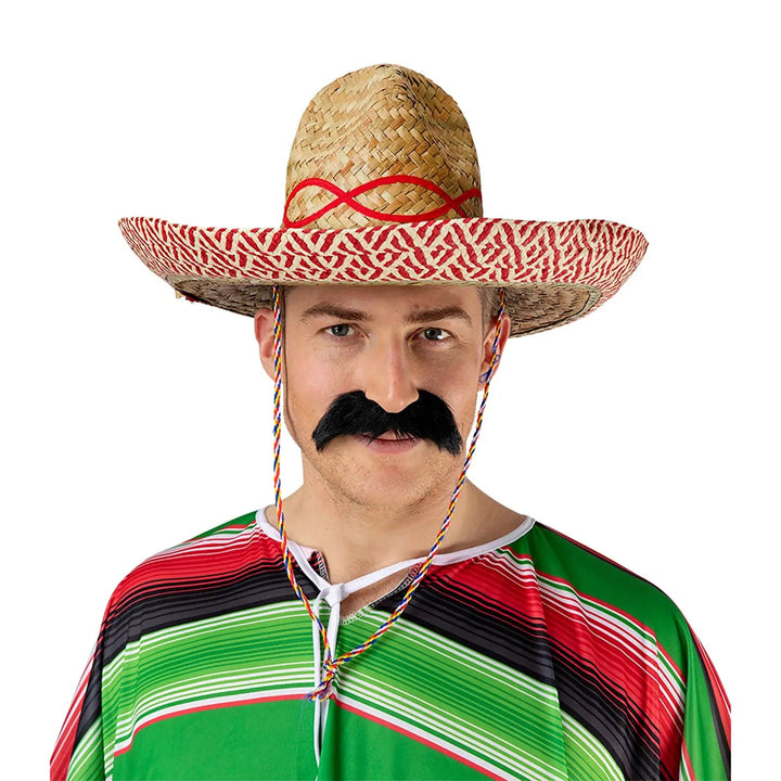 Man wearing a Mexican poncho and large sombrero hat for Halloween and fancy dress costumes