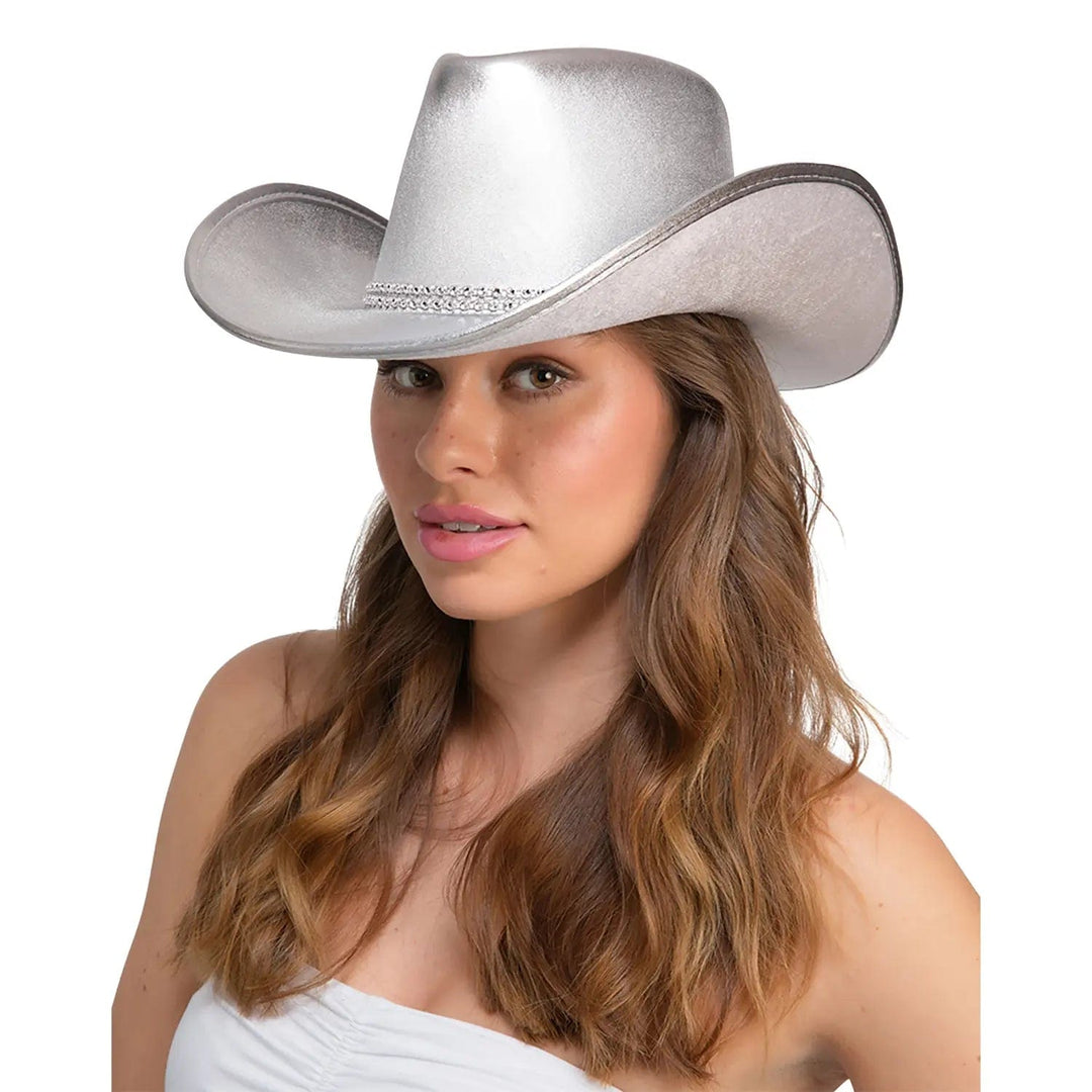 Side view of a lady wearing a silver cowboy hat with fake diamonds