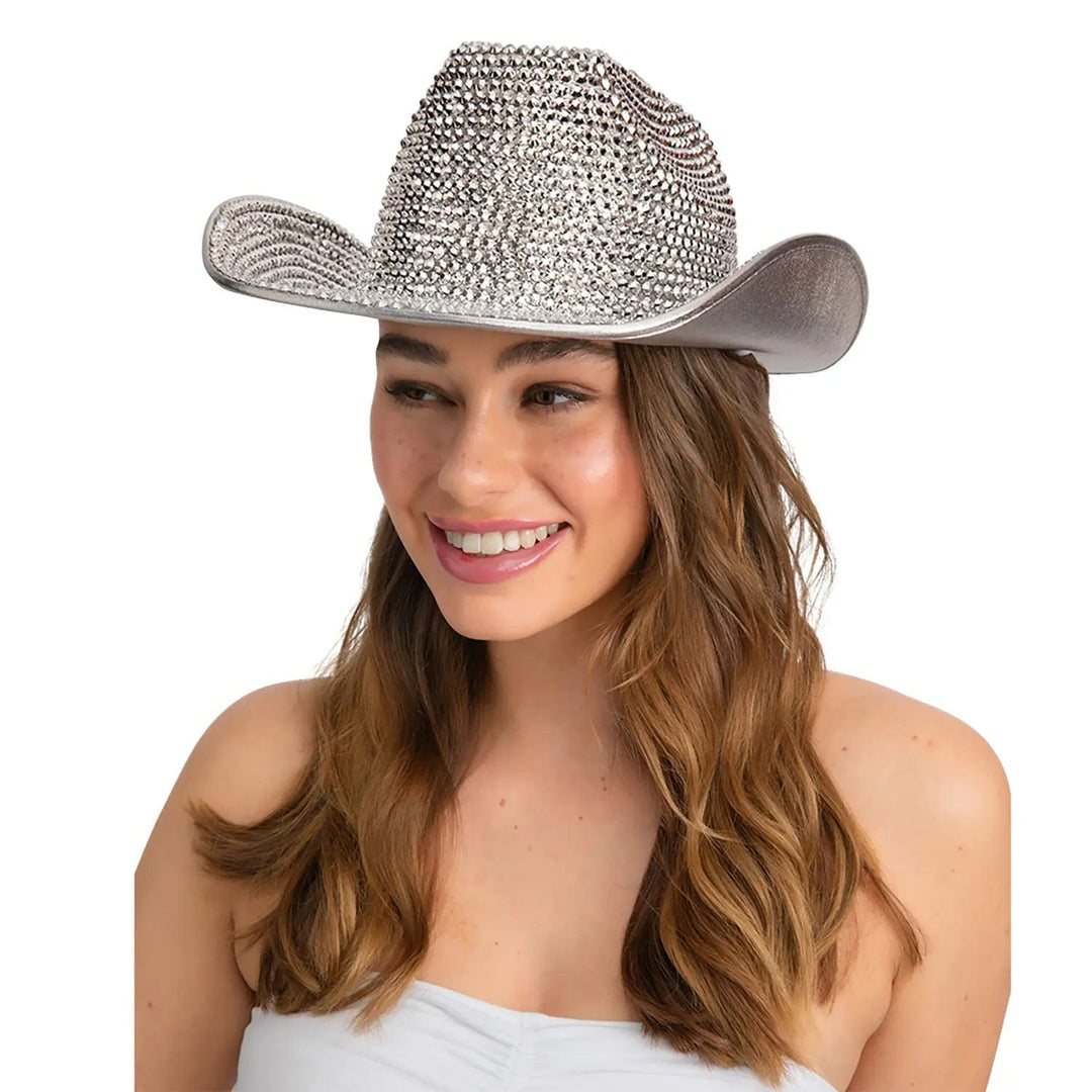 Woman wearing a silver cowboy hat covered with sparkling fake diamonds