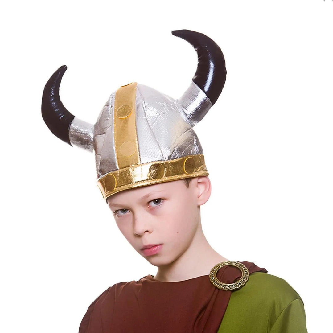 Boy wearing a silver and gold Viking helmet with soft black horns for fancy dress costumes