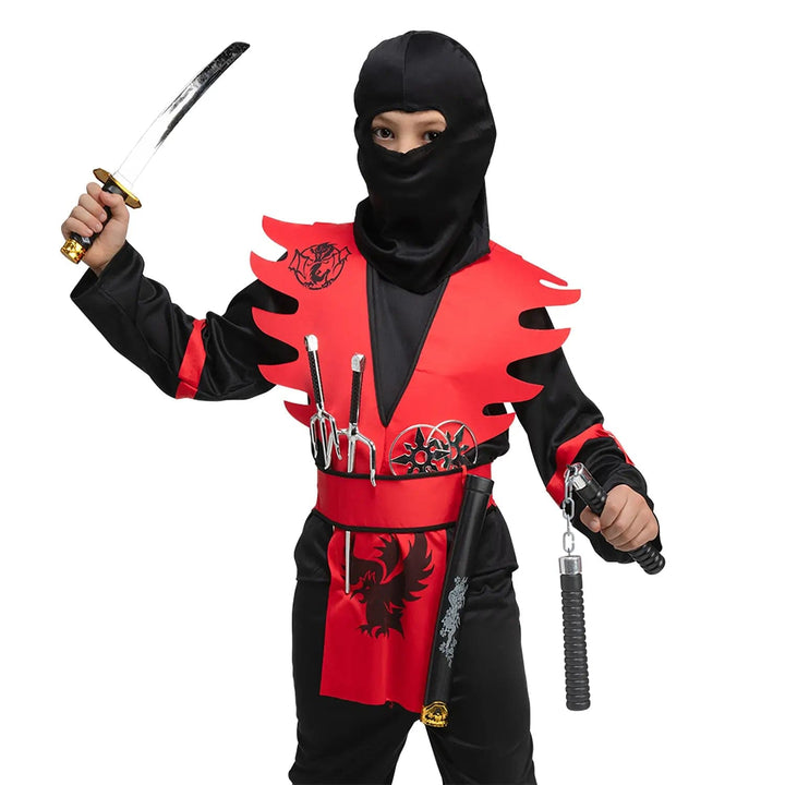 Child dressed up as a ninja with sword, nunchucks, daggers and stars