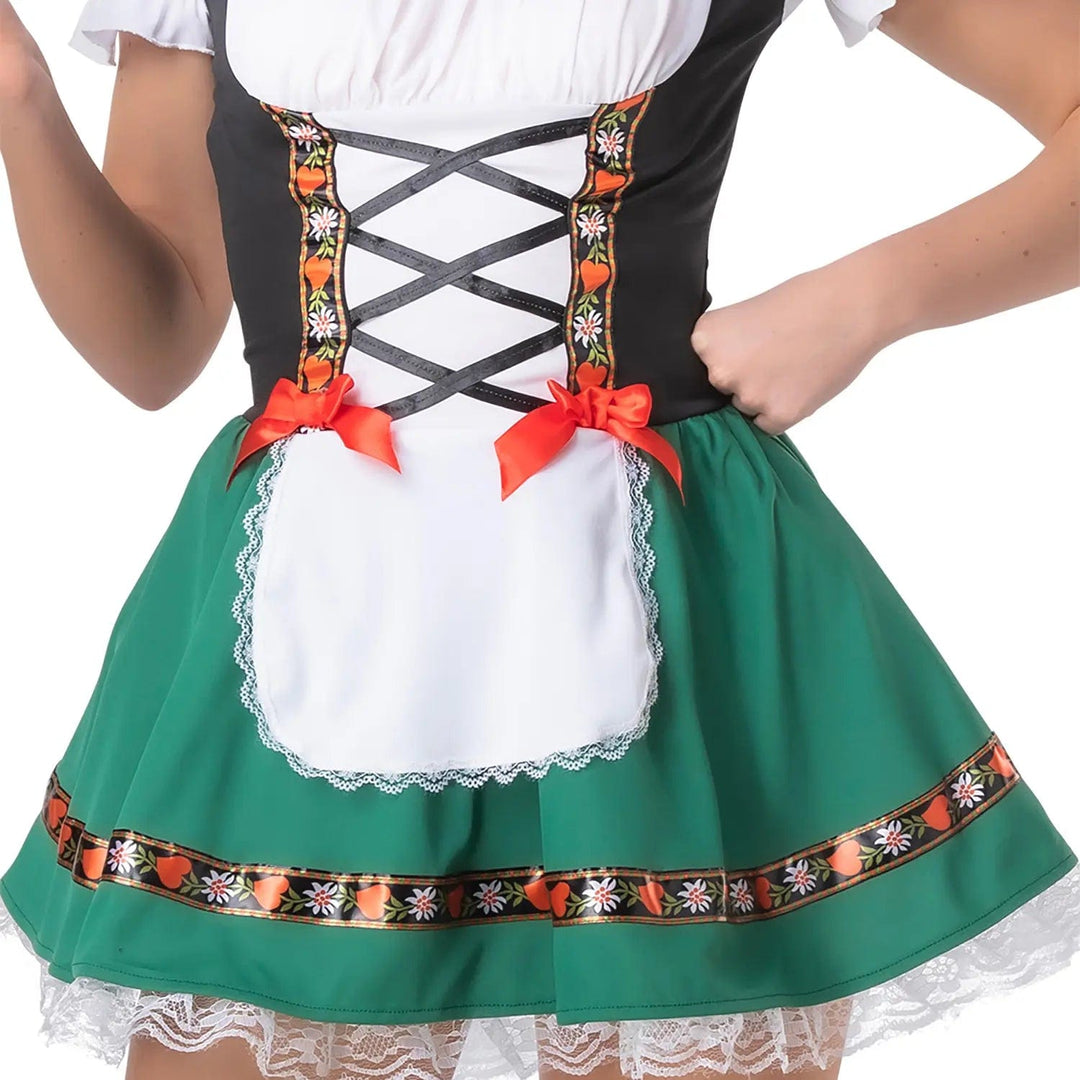 Close up of a green Bavarian style dress with short green skirt, black bodice with red satin bows and a lace trimmed white apron