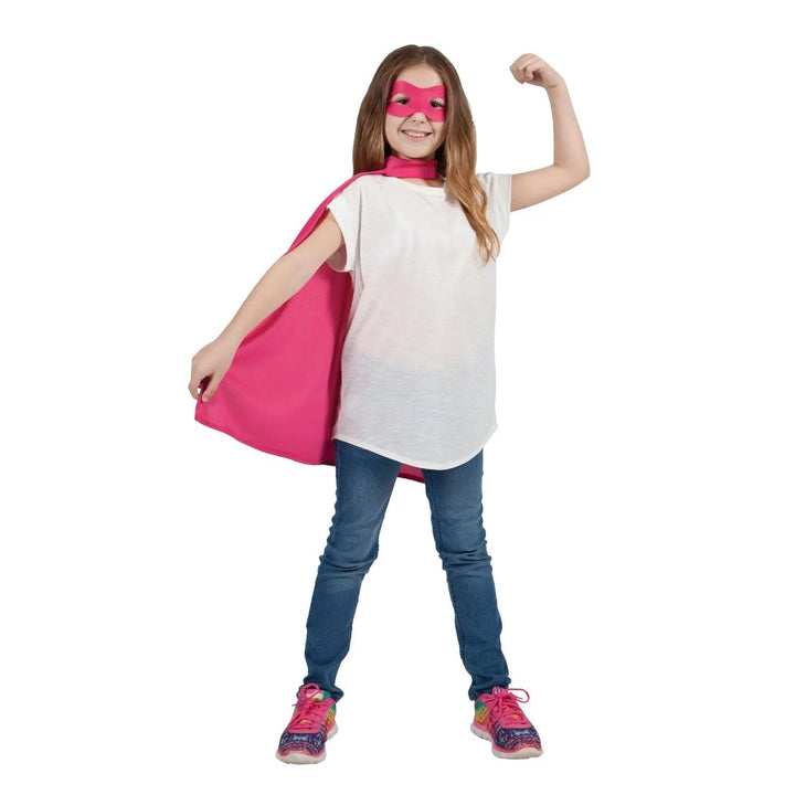 Girl wearing a pink eye mask and superhero cape for Halloween fancy dress costumes