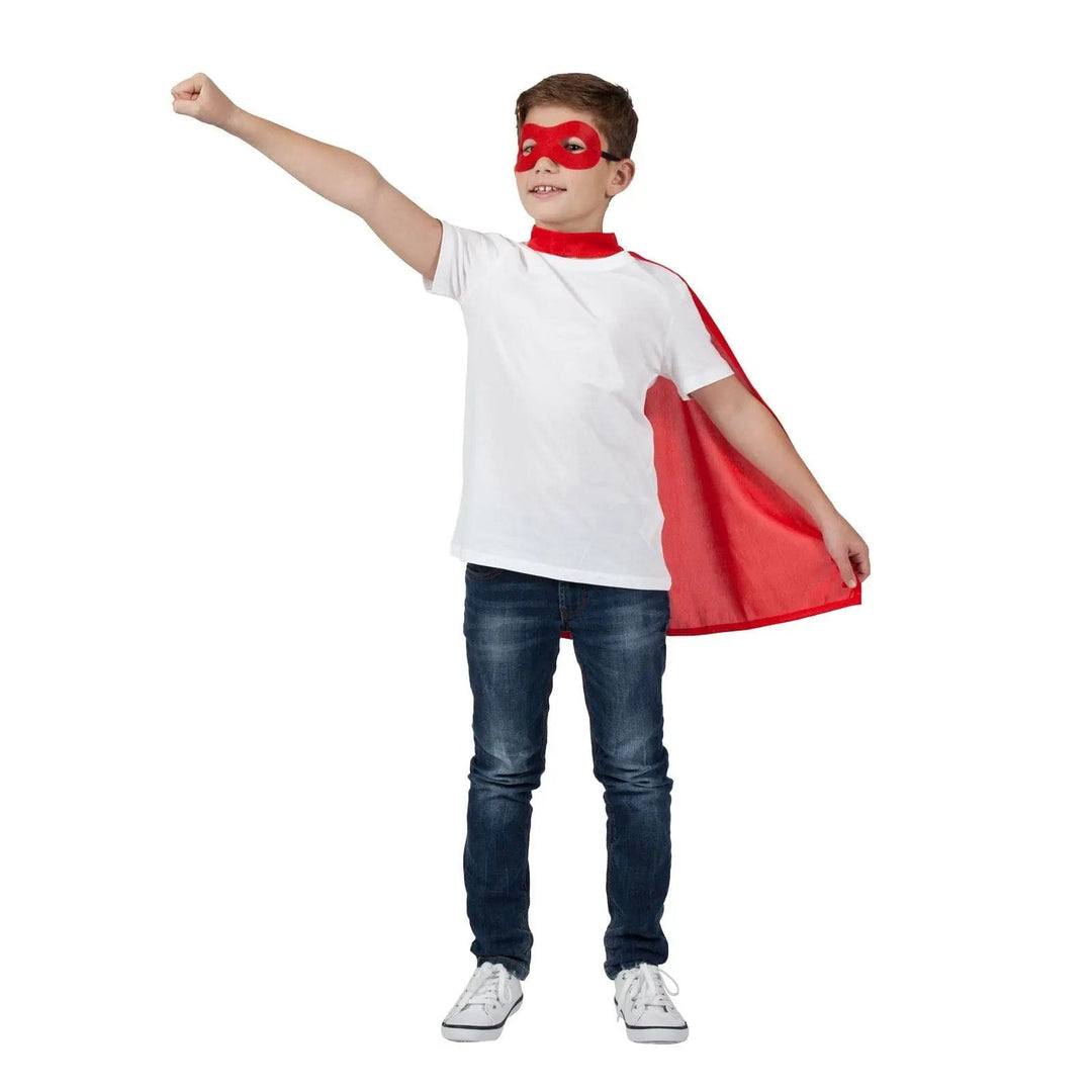 Boy wearing a red eye mask and superhero cape for Halloween fancy dress costumes