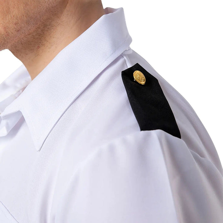 Close up of the black epaulettes with gold button on a ship's captain shirt