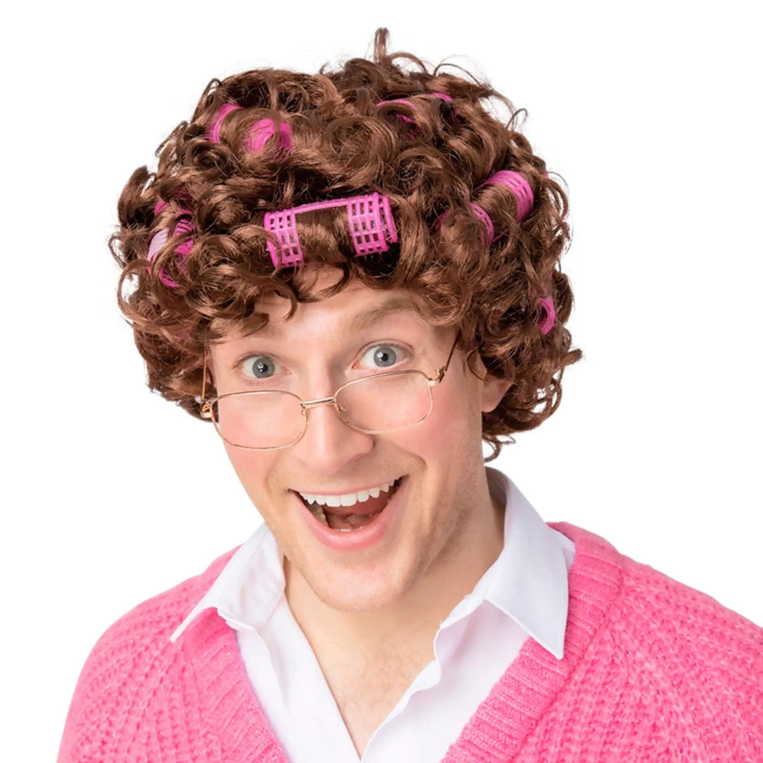 Man wearing a curly brown with with pink rollers for fancy dress and Halloween costumes