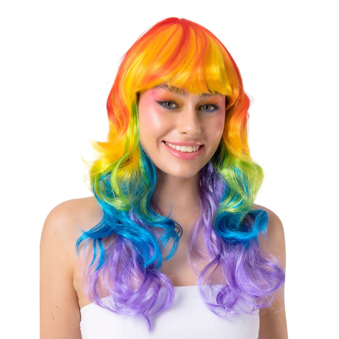 Lady wearing a long curly rainbow wig for fancy dress costumes, Pride events and festivals