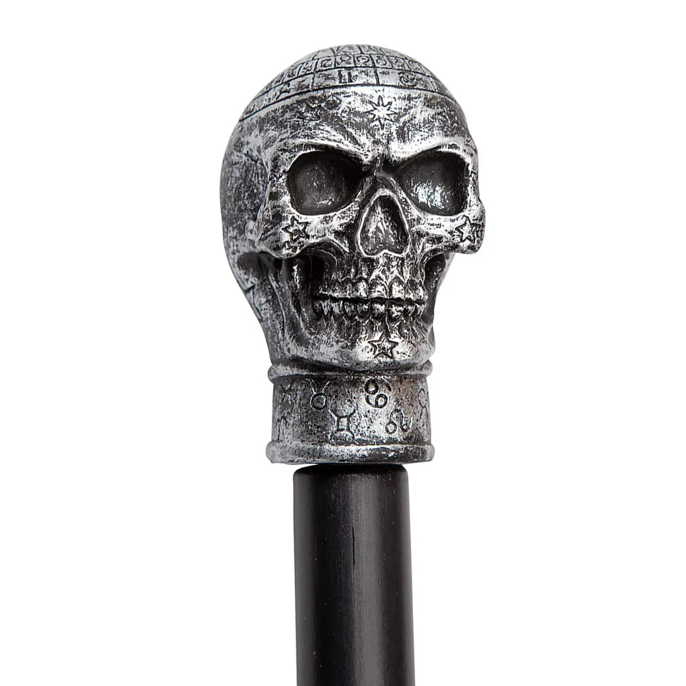 Close up of the skull top of a black plastic cane Halloween prop