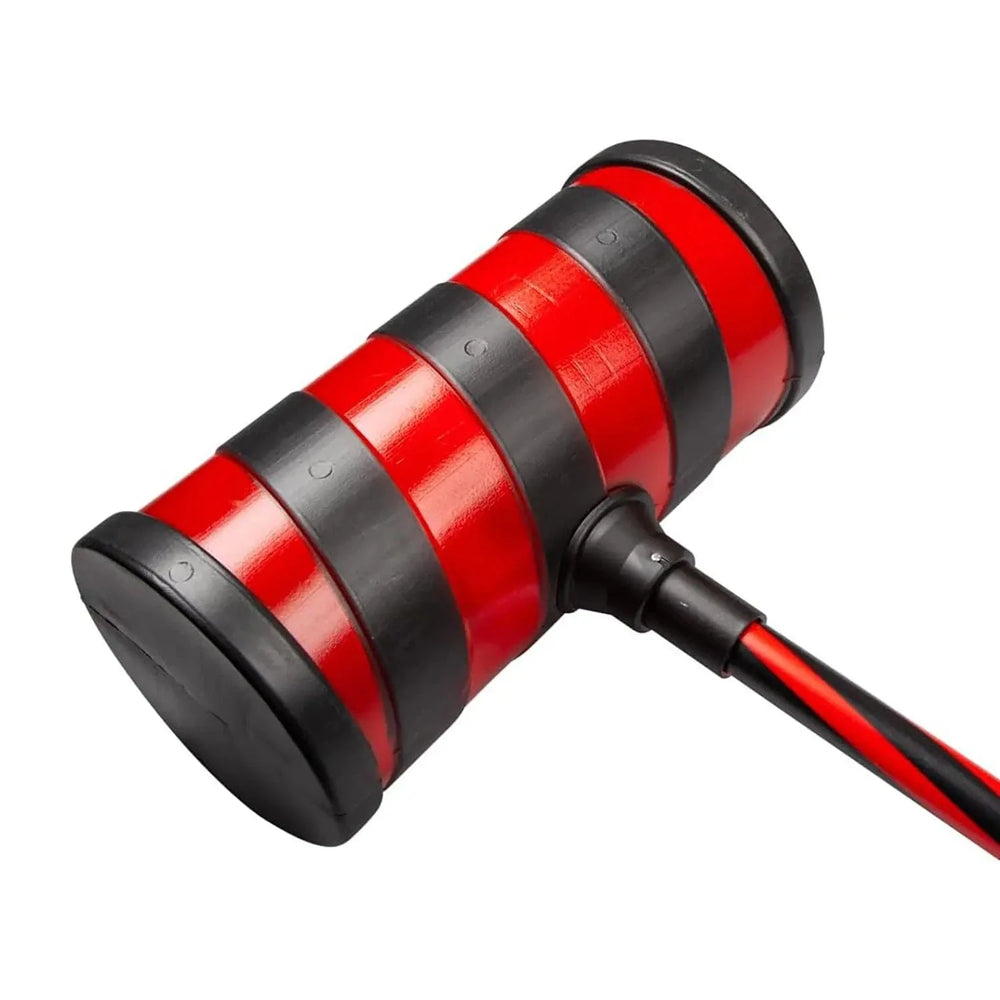 Close up of the head on a red and black striped plastic hammer for clown fancy dress costumes