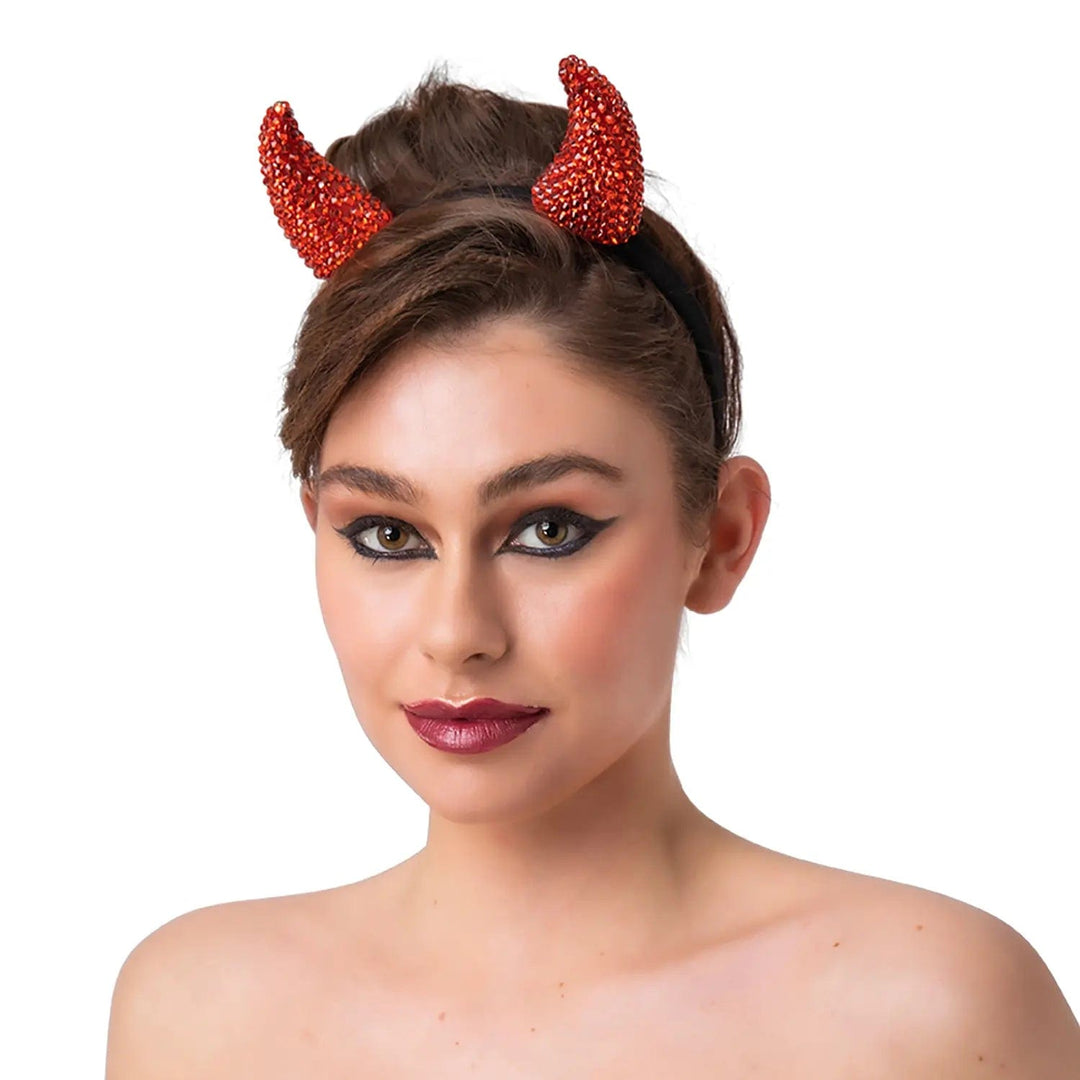 Lady wearing a pair of red sparkling devil horns on a headband for Halloween parties