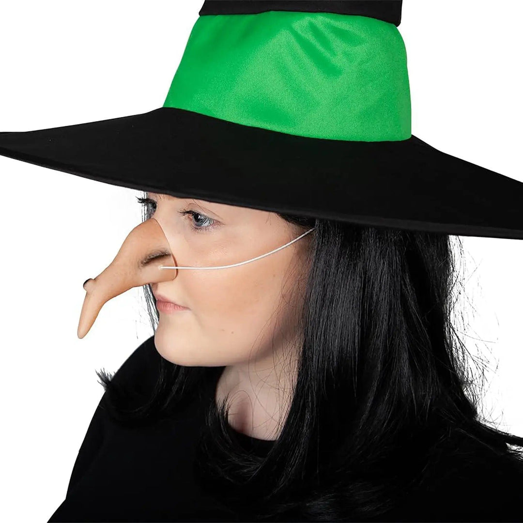 Woman wearing a green and black witch hat and a large crooked witch nose with elastic strap