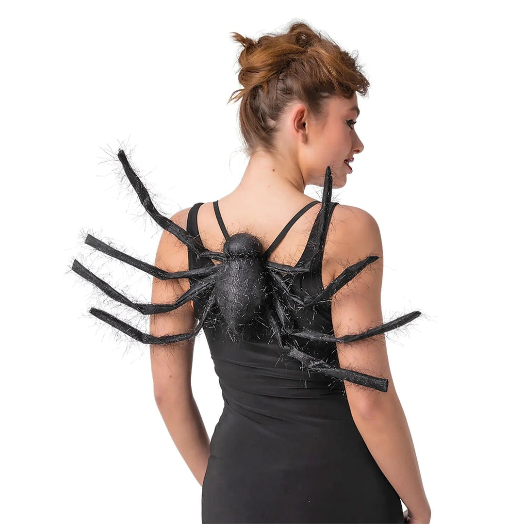 Lady wearing a large black hairy spider on her back for a Halloween party