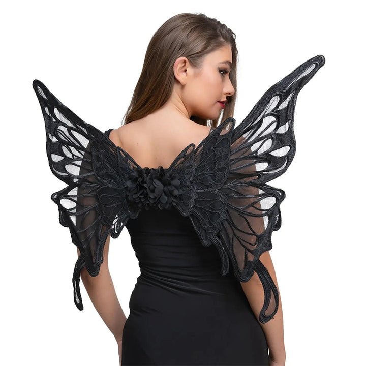 Woman wearing a pair of black butterfly lace wings with fabric flower for fancy dress parties