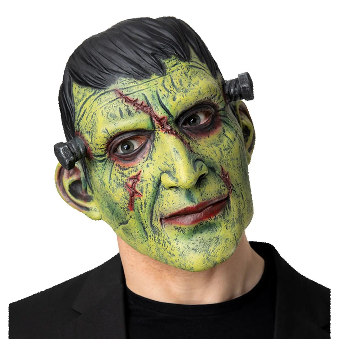 Model wearing a full over head green Frankie monster mask with head bolts and wounds effect for Halloween parties