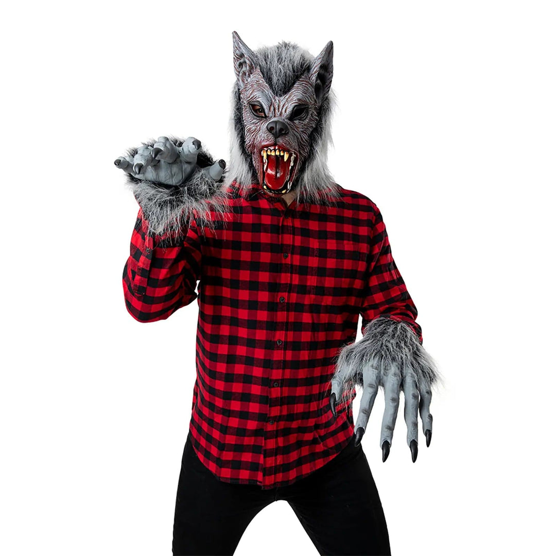 Person wearing a horror werewolf mask and gloves with claws for Halloween costumes