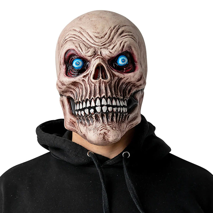 Model wearing a skeleton head mask with aged look and blue eyes that light up