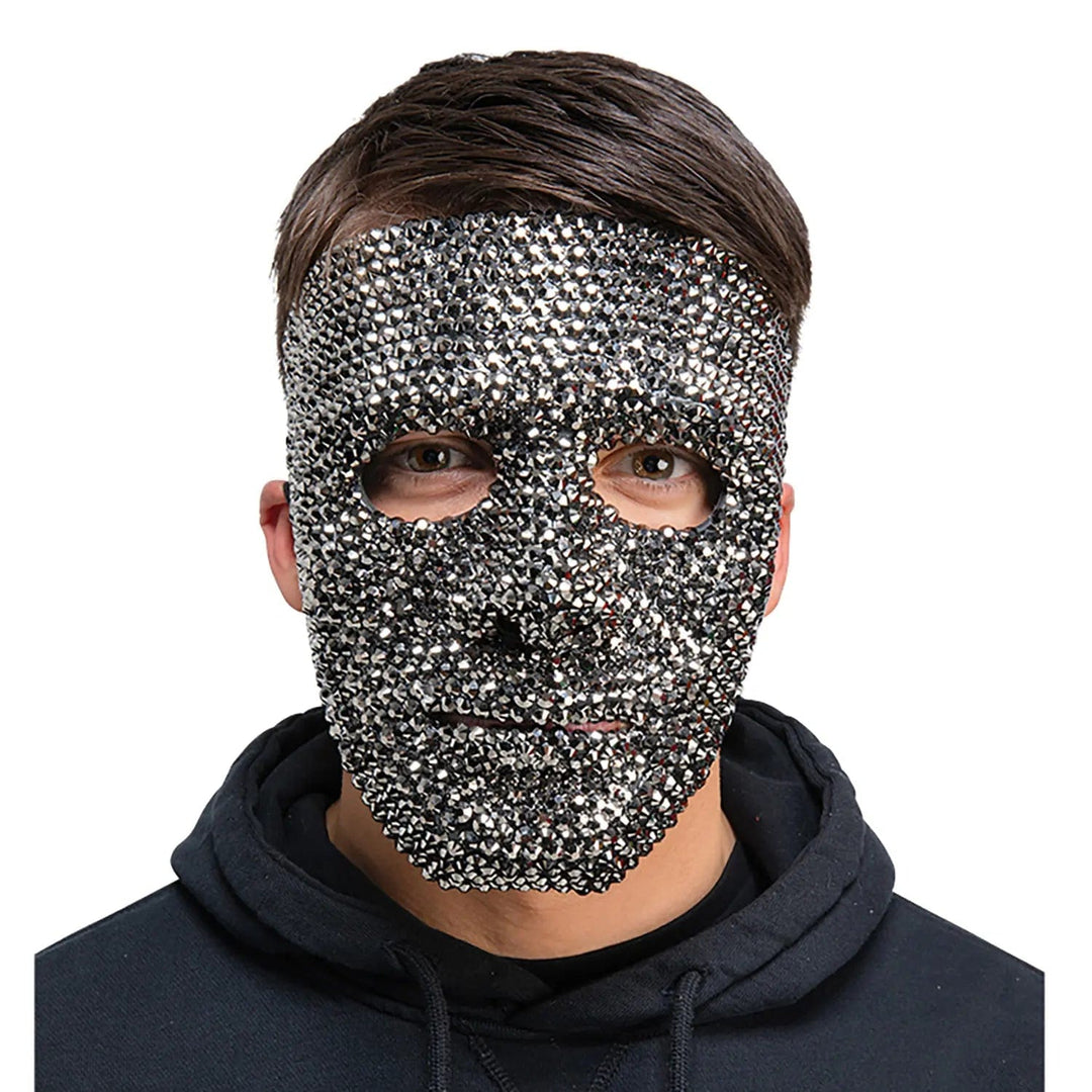 Man wearing a dark grey sparkling face mask for a robot fancy dress costume