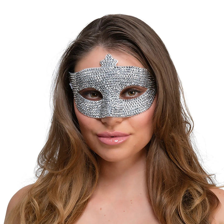 Lady wearing a eye mask covered with sparkling rhinestones